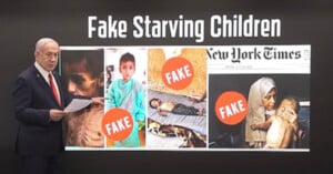 A man in a suit points to a screen displaying the headline "Fake Starving Children" above photos of children and a woman with a child, overlaid with large red "FAKE" stamps and a partial New York Times logo.