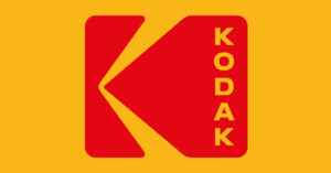 Red Kodak logo with a stylized "K" on a yellow background; the word “KODAK” appears vertically in yellow letters on the right side of the logo.
