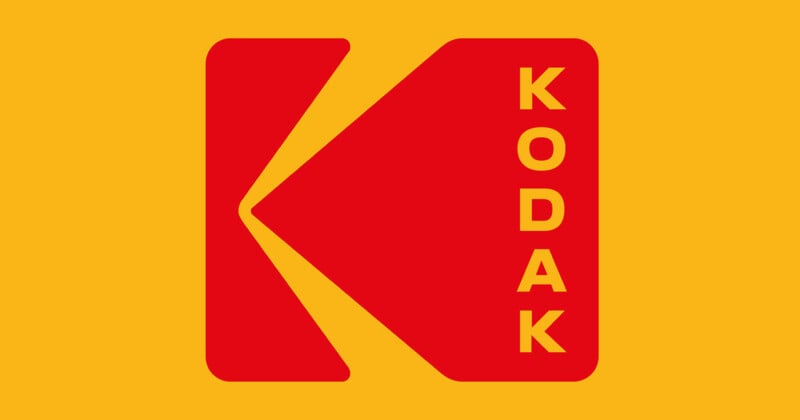 Red Kodak logo with a stylized "K" on a yellow background; the word “KODAK” appears vertically in yellow letters on the right side of the logo.