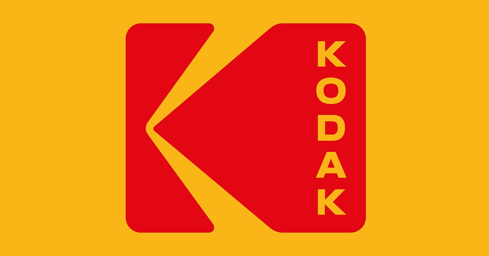 Red Kodak logo with a stylized "K" on a yellow background; the word “KODAK” appears vertically in yellow letters on the right side of the logo.