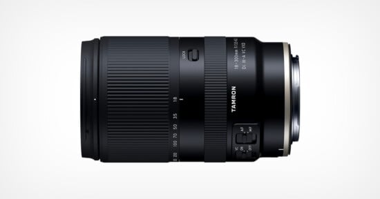 A black Tamron camera lens, model 18-300mm F/3.5-6.3 Di III-A VC VXD, shown in a side profile view on a plain white background.