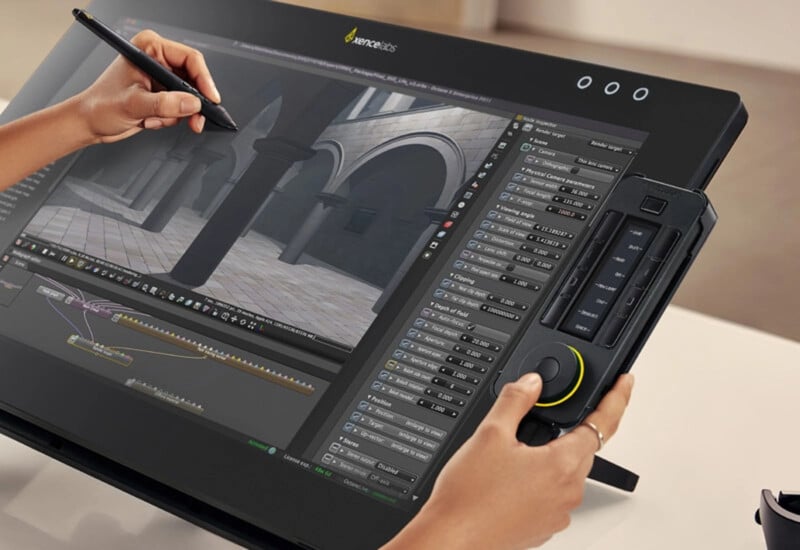 A person uses a stylus and a controller to create 3D architectural models on a large digital drawing tablet, displaying detailed modeling software with various tools and settings on the screen.