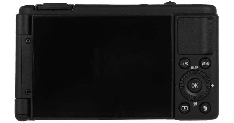 The back view of a digital camera, showing a large display screen on the left and various buttons and controls, including a circular dial and menu buttons, on the right.