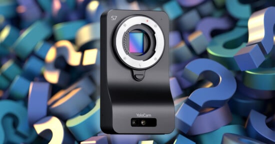 A black YoloCam S7 camera body with no lens is shown in front of a colorful background filled with overlapping 3D question marks in blue, purple, and green tones.