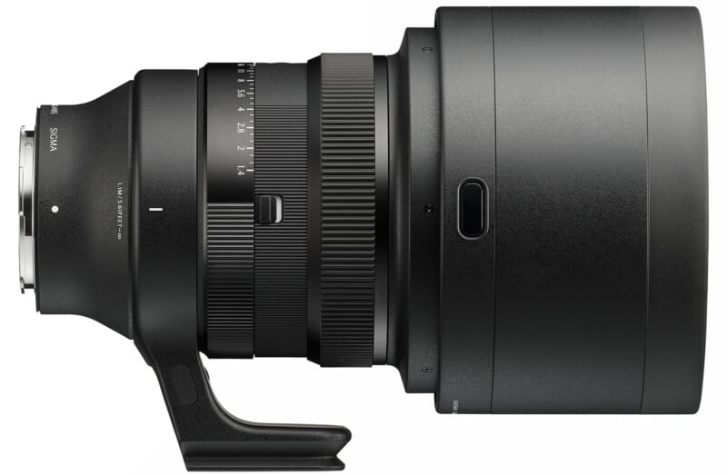 Side view of a large, black Sigma camera lens with a lens mount, focus and zoom rings, a tripod collar, and detailed markings for focal lengths and apertures.