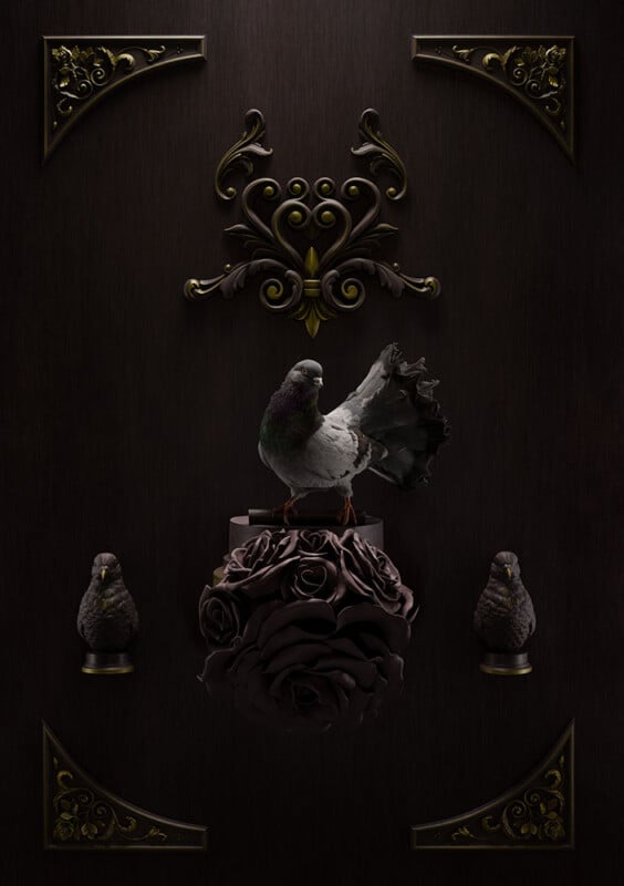 A realistic pigeon stands on dark, sculpted roses with two small bird figurines below, set against a dark wood background adorned with ornate gold decorations in the corners and center.