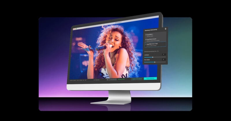 A computer monitor displays a woman singing passionately on stage with vibrant blue and purple lighting; an on-screen video editing interface is partially visible on the right side.