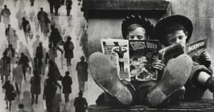 A black-and-white collage shows shadowy silhouettes of people walking on the left, and two boys in cowboy hats reading comic books with their feet up on the right.