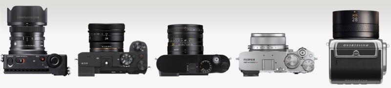 Six different digital cameras and lenses are lined up side by side, viewed from the front and top, showcasing various shapes, buttons, and dials against a light gradient background.
