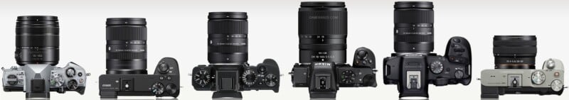 Six digital cameras with attached lenses are lined up side by side, shown from the front and top view. Each camera has a different design, size, and lens configuration.