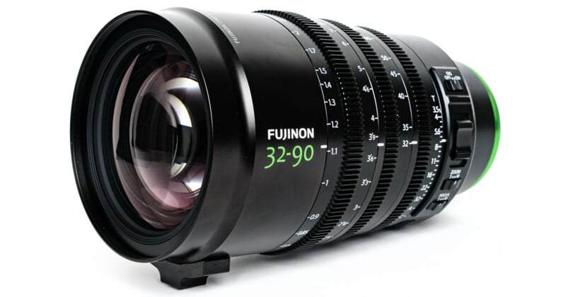A Fujinon camera lens with a focal length of 32-90mm, featuring detailed focus and zoom adjustment rings, is displayed on a white background.