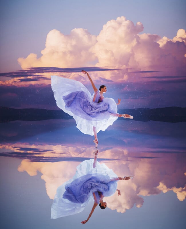 A ballerina in a flowing lavender dress dances gracefully on tiptoes against a backdrop of vibrant clouds, her reflection mirrored perfectly in the still water below.