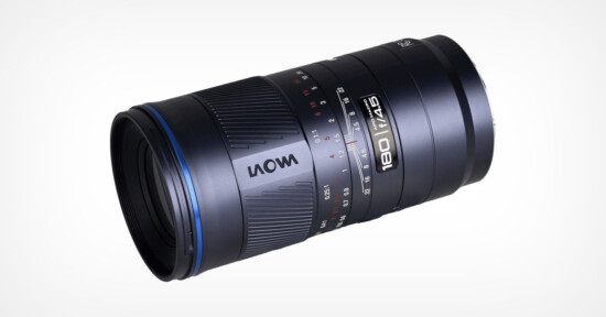 A close-up photo of a black Laowa 100mm f/2.8 2:1 Ultra Macro APO camera lens, showing detailed focus and aperture markings on a white background.