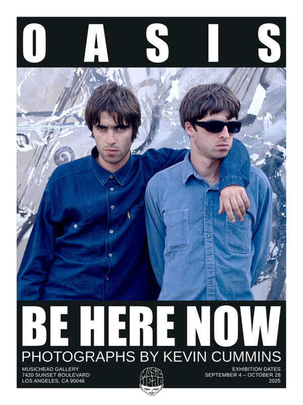 Two men in denim shirts stand close together against a weathered, graffiti-covered wall. Bold text above reads "OASIS." Below, it says, "BE HERE NOW, Photographs by Kevin Cummins," with exhibition details at the bottom.