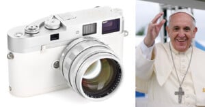 A silver Leica camera with a large lens is shown on the left; on the right, Pope Francis, wearing white robes and a cross necklace, is smiling and waving.