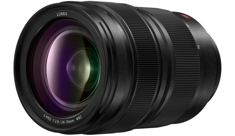 A black Panasonic Lumix camera lens with a large front element, textured zoom and focus rings, and white labeling indicating it is an S Pro 24-70mm f/2.8 lens with an 82mm filter thread.