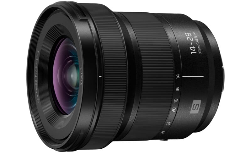 A black Panasonic Lumix camera lens with focal length markings from 14 to 28mm, featuring textured grip rings and a visible lens glass element with a purple reflection.