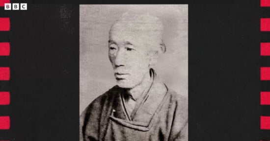 A black-and-white portrait of an elderly person wearing traditional Japanese clothing, centered on a textured background with red and black borders. The BBC logo appears in the top left corner.