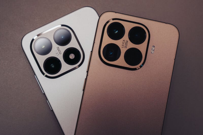 Two smartphones are shown side by side, focusing on their large rear camera modules with three lenses each. One phone is silver and the other is gold, both set against a neutral background.