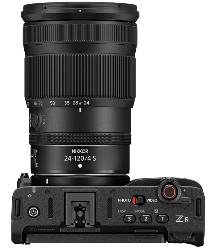 A top view of a Nikon Z series mirrorless camera with a NIKKOR Z 24-120mm f/4 S lens attached, showing various camera controls, buttons, and dials.