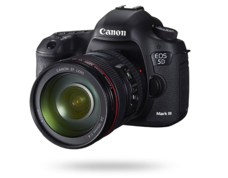 A Canon EOS 5D Mark III digital SLR camera with a Canon EF lens attached, shown at an angle on a white background with a shadow below.