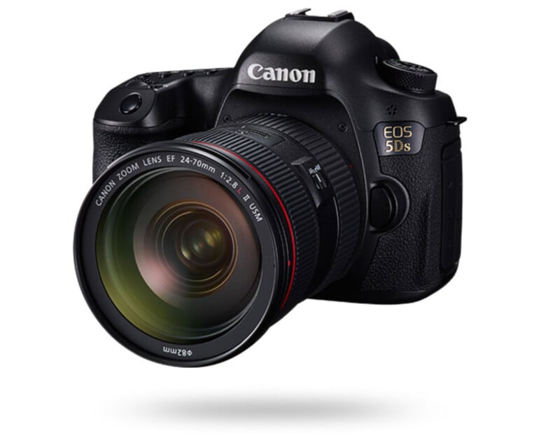 A black Canon EOS 5DS digital camera with a large Canon Zoom Lens EF 24-70mm f/2.8L attached, shown angled to the right on a white background.