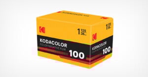 A yellow and black Kodak Kodacolor 100 color negative film box, labeled for 35mm film with 36 exposures. The box features red, white, and black accents and Kodak branding on a white background.
