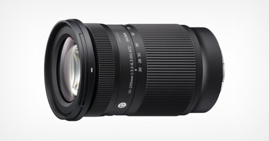 A black Sigma 18-200mm camera lens with zoom and focus rings, placed on a white background. The lens has white markings indicating focal lengths and other specifications.