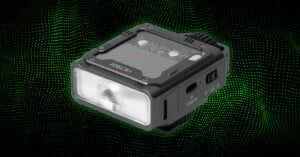 A compact, rectangular LED device labeled "VILTROX," shown against a black background with green dotted waves. The device has a translucent front light panel and visible buttons and ports on the sides.