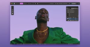 A photo editing software interface displays a portrait of a person in a green jacket and gold chains against a purple sky background, with editing tools and adjustment panels visible on the screen.