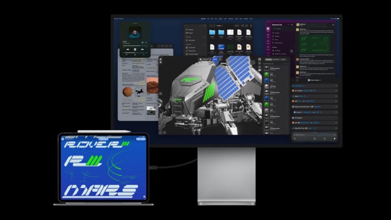 A desktop monitor displays multiple app windows, including 3D modeling software, messaging, folders, and a web browser. An iPad with a “Rover 2 Mars” graphic is connected via cable, extending the workspace.