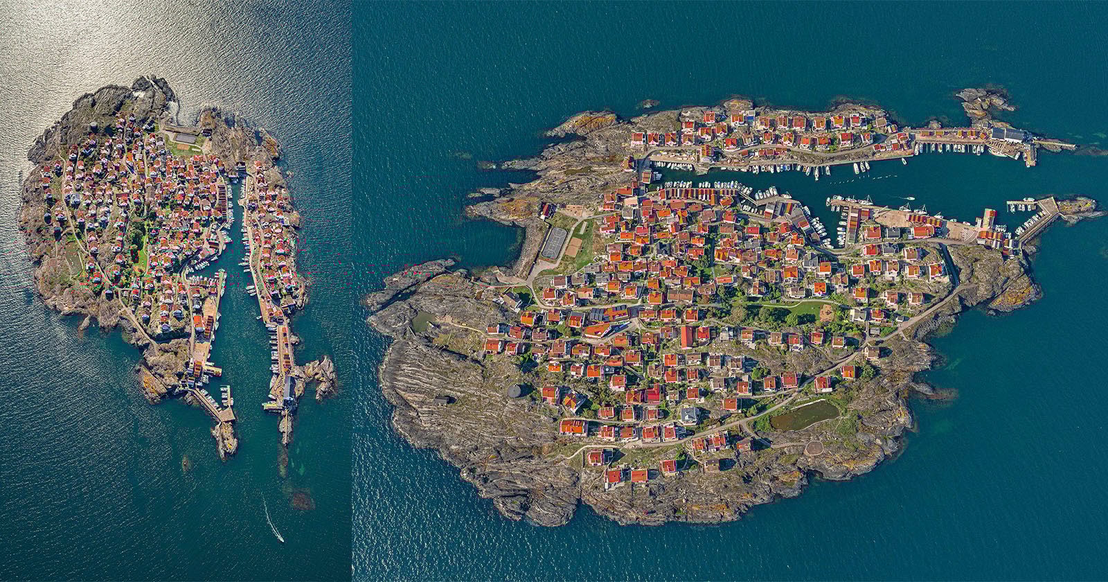 Aerial view of two rocky islands with dense clusters of red-roofed houses surrounded by deep blue water; the left island is smaller, while the right island is larger with more buildings and green patches.