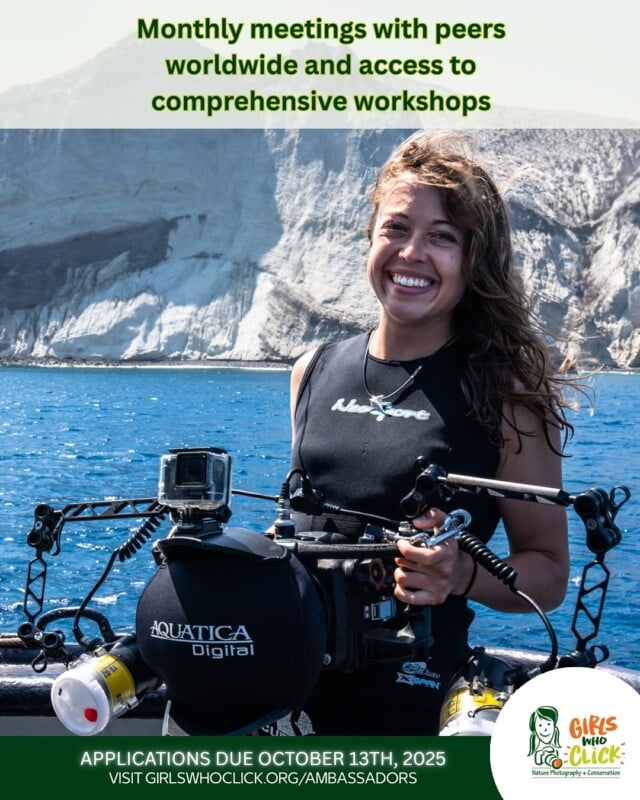 A smiling woman in a wetsuit holds an underwater camera rig on a boat, with blue ocean and cliffs in the background. Text above and below promotes Girls Who Click workshops and application deadlines.