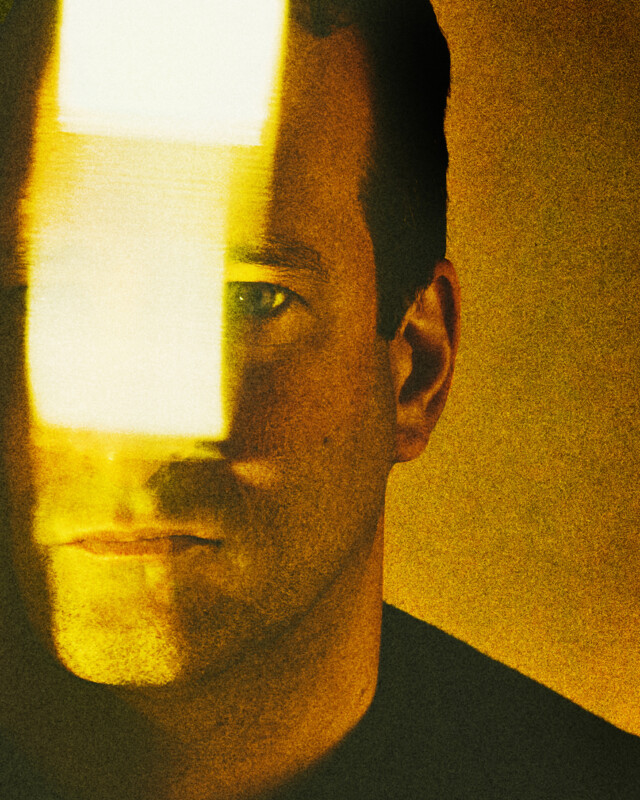 A man with a light on his face.