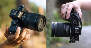 Two hands holding Nikon cameras outdoors; the left side shows a camera angled upward, while the right side shows a camera held from above, both with attached zoom lenses.