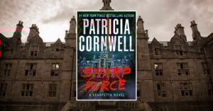 The book cover of Patricia Cornwell’s "Sharp Force: A Scarpetta Novel" is centered over a dark, gothic-style building with sharp roof peaks and windows, under a cloudy sky. Red and blue text dominate the book cover.