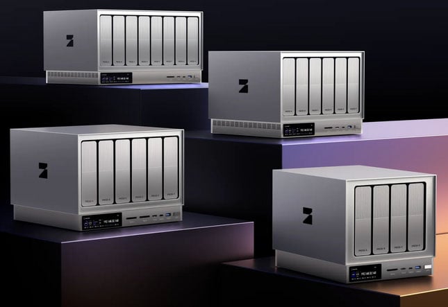 Four modern, silver network-attached storage (NAS) devices with multiple drive bays are displayed on elevated, geometric platforms against a dark background with gradient lighting.