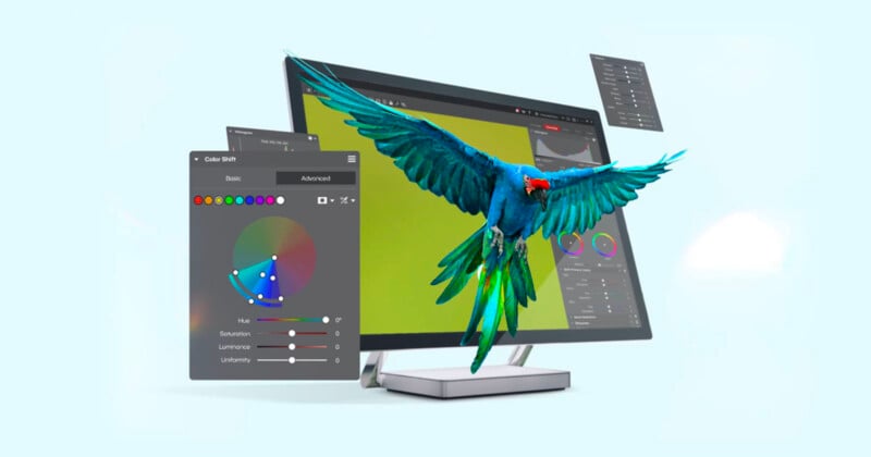A colorful parrot appears to fly out of a computer monitor displaying graphic design software, with color adjustment panels and editing tools floating in the air.