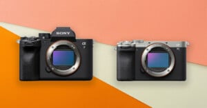 Two Sony Alpha mirrorless cameras without lenses are displayed side by side on a colorful background with peach, light pink, and orange geometric shapes.