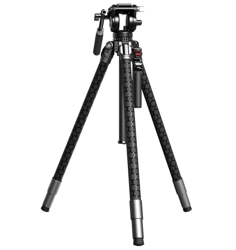 A black, three-legged camera tripod with hexagonal patterns on the legs, silver accents at the joints, and an adjustable pan-and-tilt head against a white background.