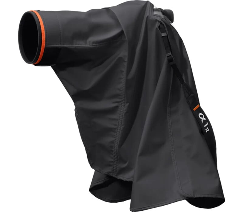 A black rain cover for a camera and lens, featuring an orange accent and a strap labeled "α1." The cover is designed to protect photography equipment from weather.