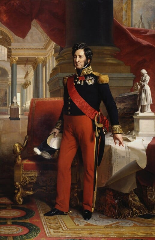 A regal man in a decorated military uniform with red pants and a sash stands beside a red chair, holding a hat, with classical columns and statues in the ornate background.