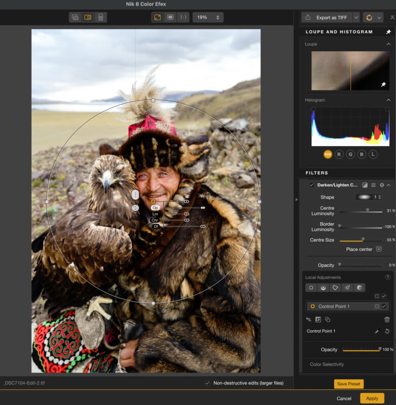 A man in traditional fur clothing holds a golden eagle outdoors in a rocky, mountainous landscape; photo editing software interface is visible with adjustment tools on the right.
