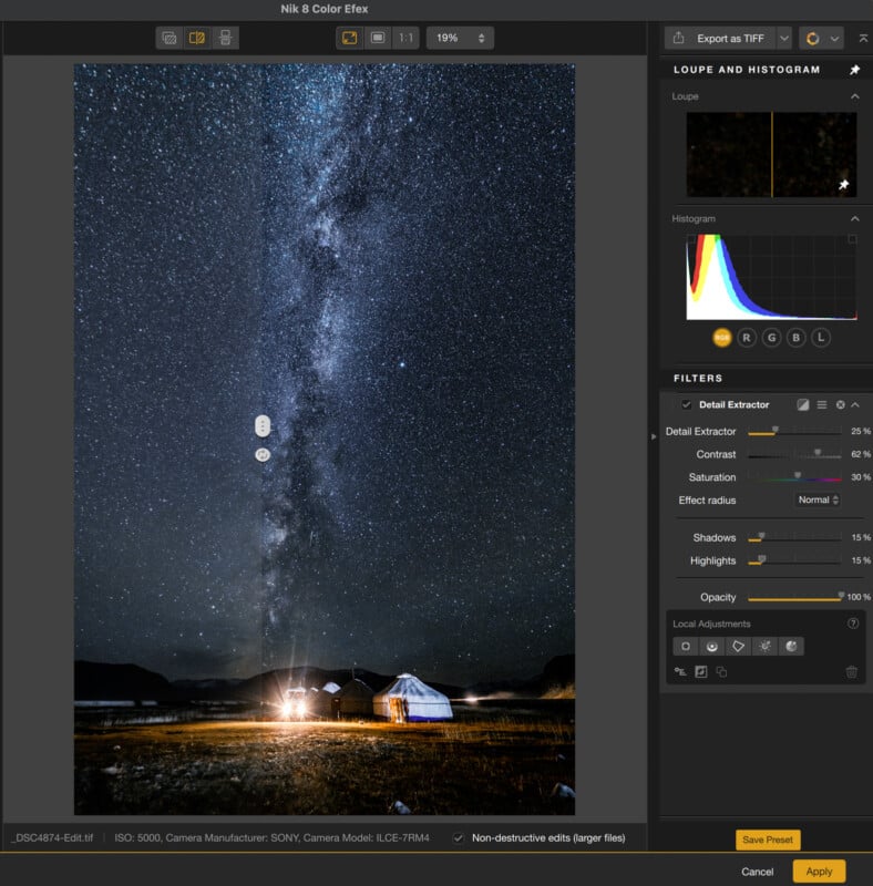 A nighttime photo editing interface shows a starry sky with the Milky Way above a lit tent and a small building in a field; editing tools and histogram appear on the right side of the screen.