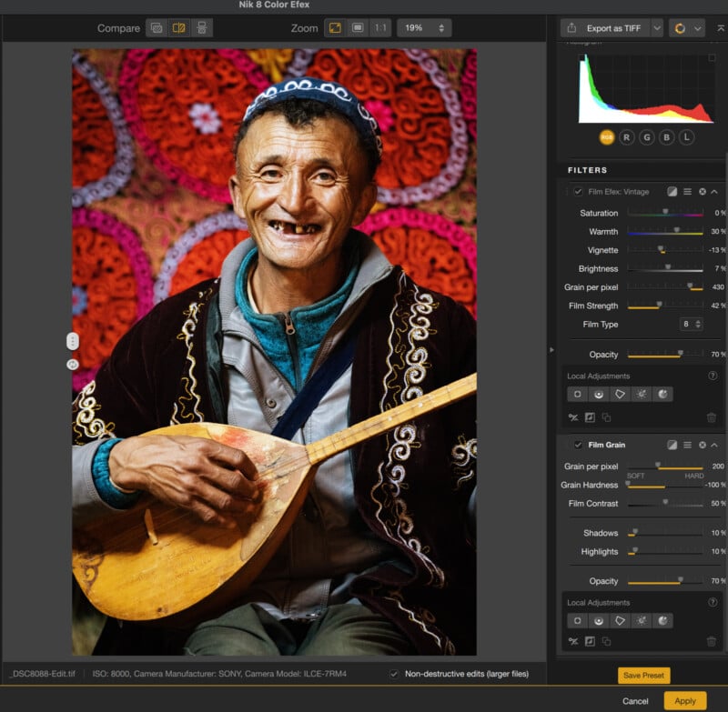 A smiling elderly man in traditional clothing plays a stringed instrument. Photo editing software interface surrounds the image, showing various adjustment sliders and editing options on the right side of the screen.