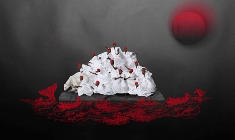 A group of people in white garments and red head coverings huddle on a grey rock. Below, red drawings depict rough sea waves and boats; a large red sun or moon glows in the dark sky.