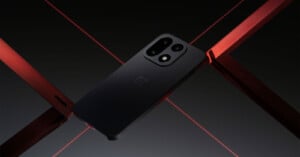 A sleek black smartphone with dual rear cameras lies diagonally on a dark surface, intersected by metallic red bars and red laser-like lines, creating a futuristic and stylish composition.