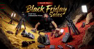 A man kneels in a cave surrounded by cameras, tripods, lights, and tech gear. Gold and red glitter cover the ground. Text reads, "Black Friday Sales, Nov 20 - Dec 1. Grab Your Unbeatable Prices.