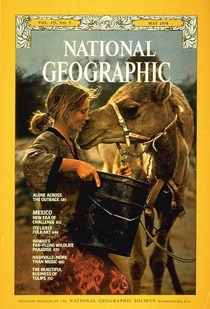 A woman holding a black bucket stands close to a camel, touching its face, on the May 1978 cover of National Geographic magazine. The magazine’s yellow border and headlines are visible.