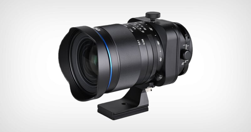 A wide-angle camera lens with a large front element, black metal body, blue accent ring, multiple adjustment dials, and a tripod mounting bracket, set against a plain white background.